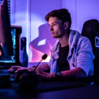 Guy playing online game on Computer